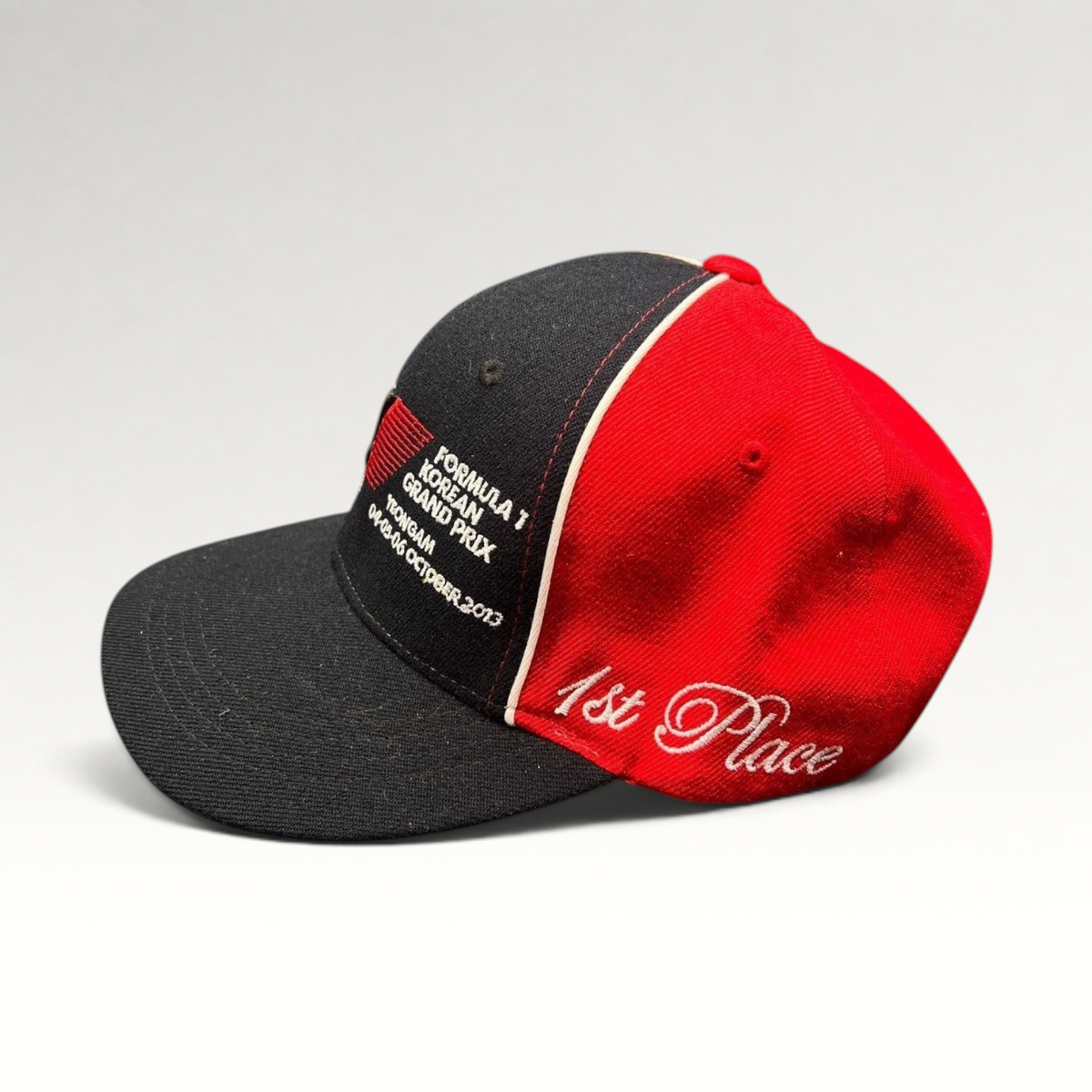 Raree Finds 2013 Formula 1 Korean Grand Prix 1st Place snapback hat in black and red cotton with white embroidery.
