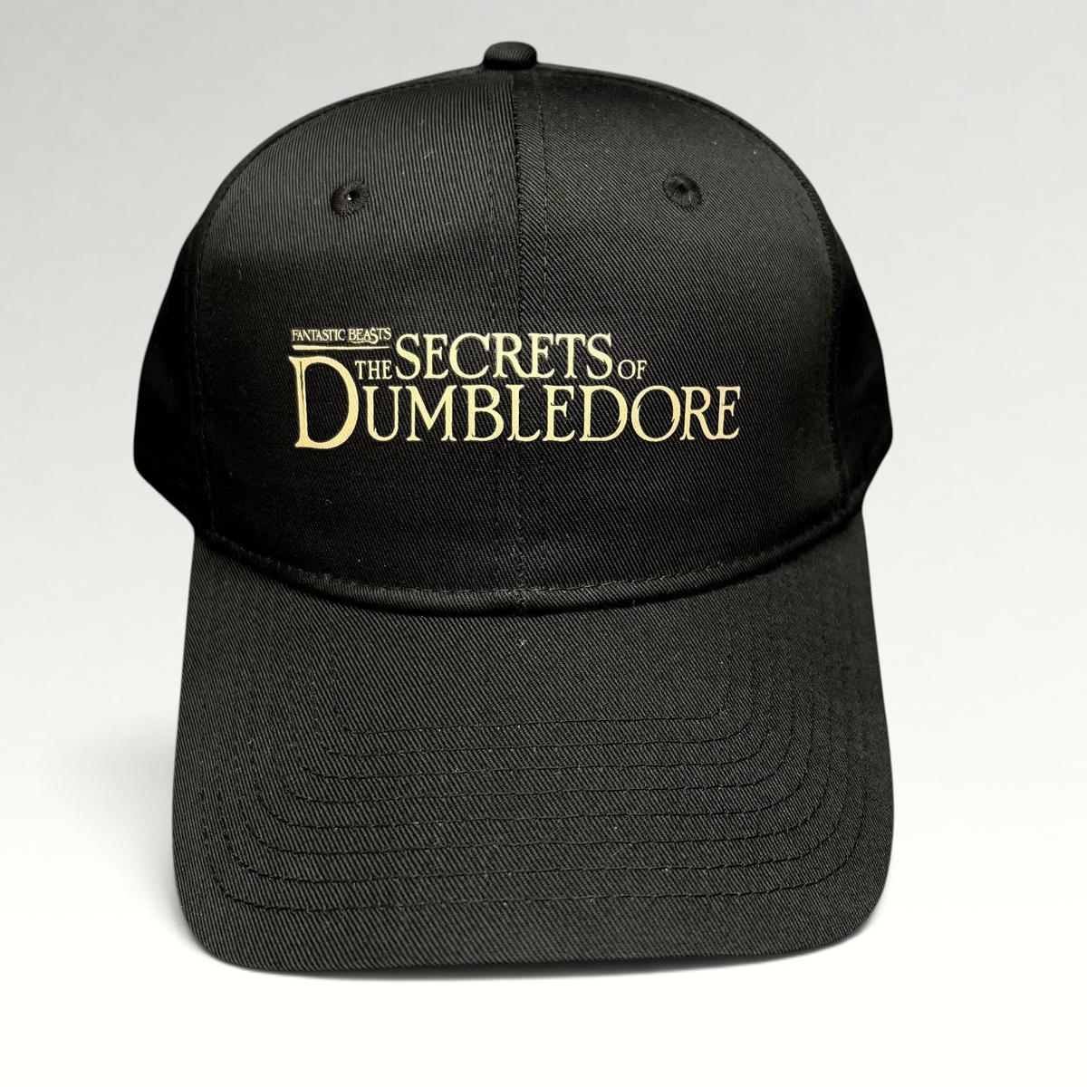 Raree Finds black snapback hat featuring gold embroidered Fantastic Beasts The Secrets of Dumbledore movie logo