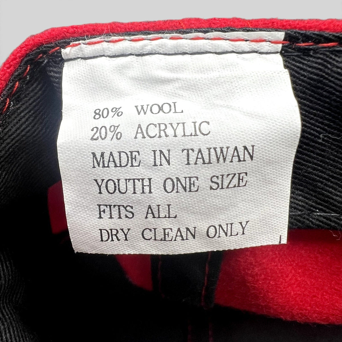 Raree Finds vintage FAO Schwarz hat interior care label showing wool and acrylic material composition