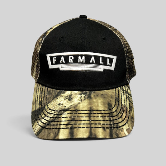 Raree Finds Farmall trucker hat with black cotton crown, camouflage brim, mesh back, and metallic logo patch