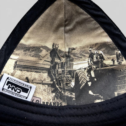 Raree Finds Farmall CNH trucker hat interior featuring a vintage black and white farming scene print and logo tag