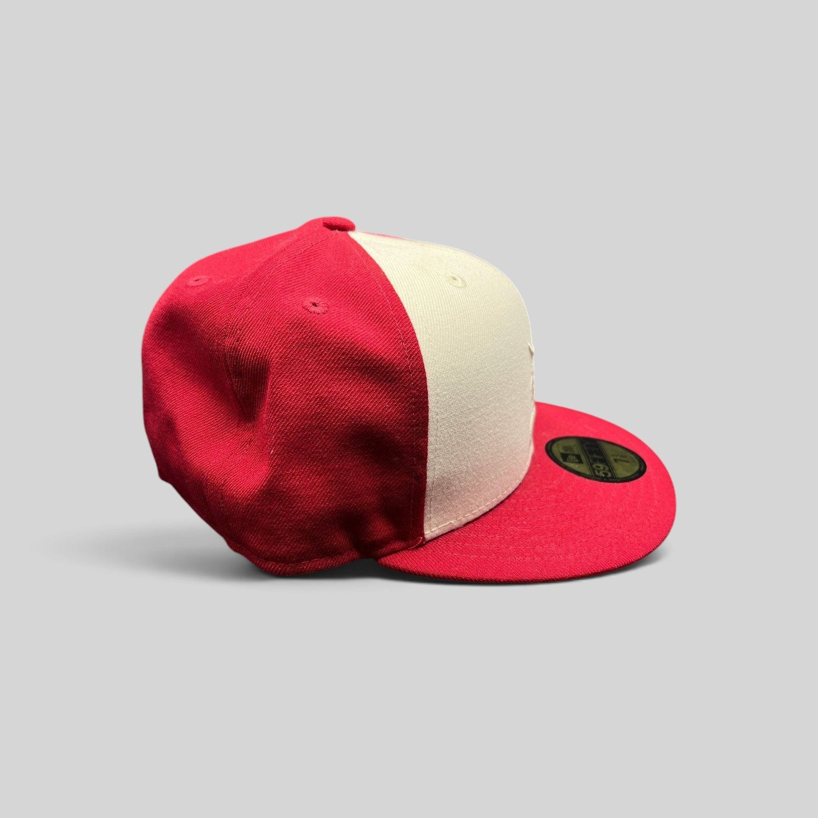 Raree Finds Fear of God Essentials x New Era 59FIFTY fitted cap in red and white wool with a flat brim.