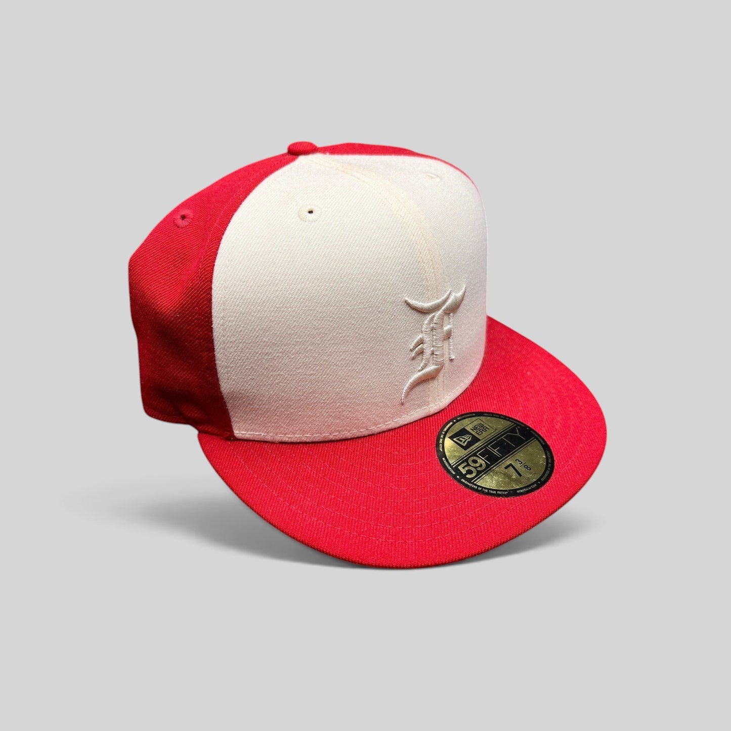 Raree Finds Fear of God Essentials x New Era 59FIFTY fitted hat in red and white wool with white embroidered F logo.