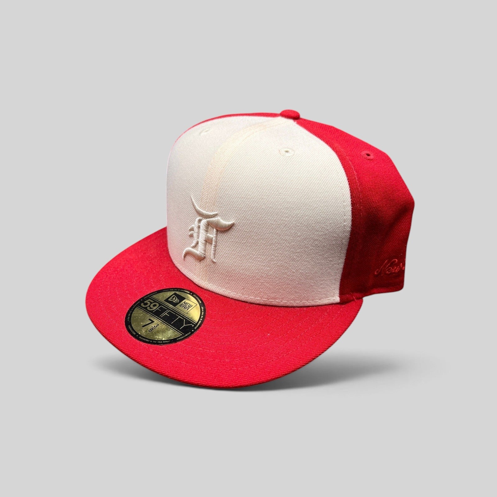 Raree Finds Fear of God Essentials x New Era 59FIFTY fitted hat in red and white wool with white embroidered F logo.