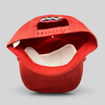Raree Finds vintage Firestone Racing red snapback hat showing the interior adjustable strap and white mesh lining