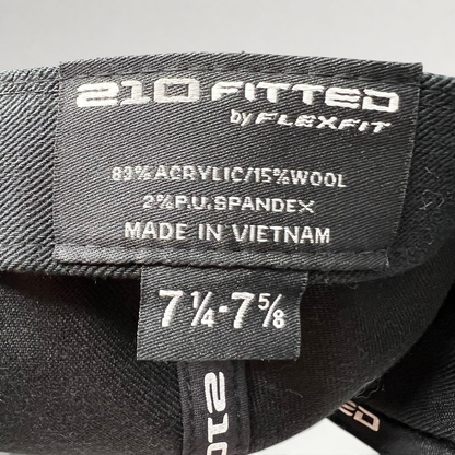 Raree Finds black Flexfit 210 fitted hat interior label showing size 7 1/4 to 7 5/8 and material composition