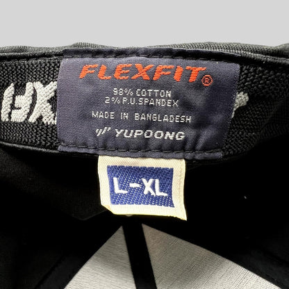 Raree Finds black Flexfit golf cap interior label showing size L/XL and cotton spandex material composition