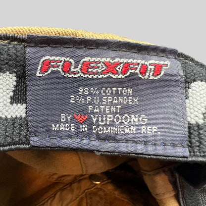 Raree Finds Flexfit hat interior label showing cotton spandex material composition and Yupoong manufacturing details