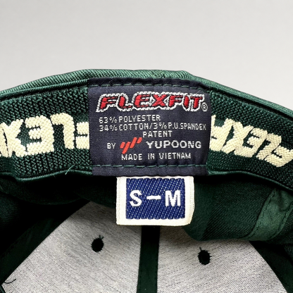 Raree Finds forest green Hanalei Canoe Club hat interior showing Yupoong Flexfit tag and size S/M label