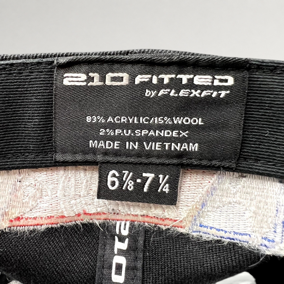 Raree Finds 2011 USASA National Championships hat interior label showing Flexfit 210 sizing and material composition