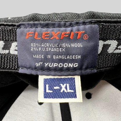 Raree Finds black Flexfit Yupoong hat interior label showing size L/XL and material composition