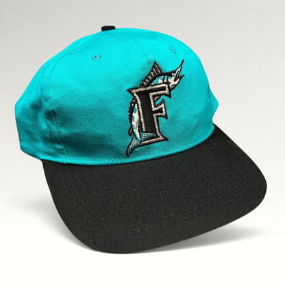 Raree Finds vintage Florida Marlins youth snapback cap with teal crown, black brim, and embroidered marlin F logo.