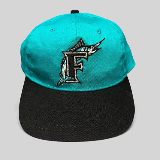 Raree Finds vintage Florida Marlins youth snapback cap with teal crown, black brim, and embroidered marlin F logo.