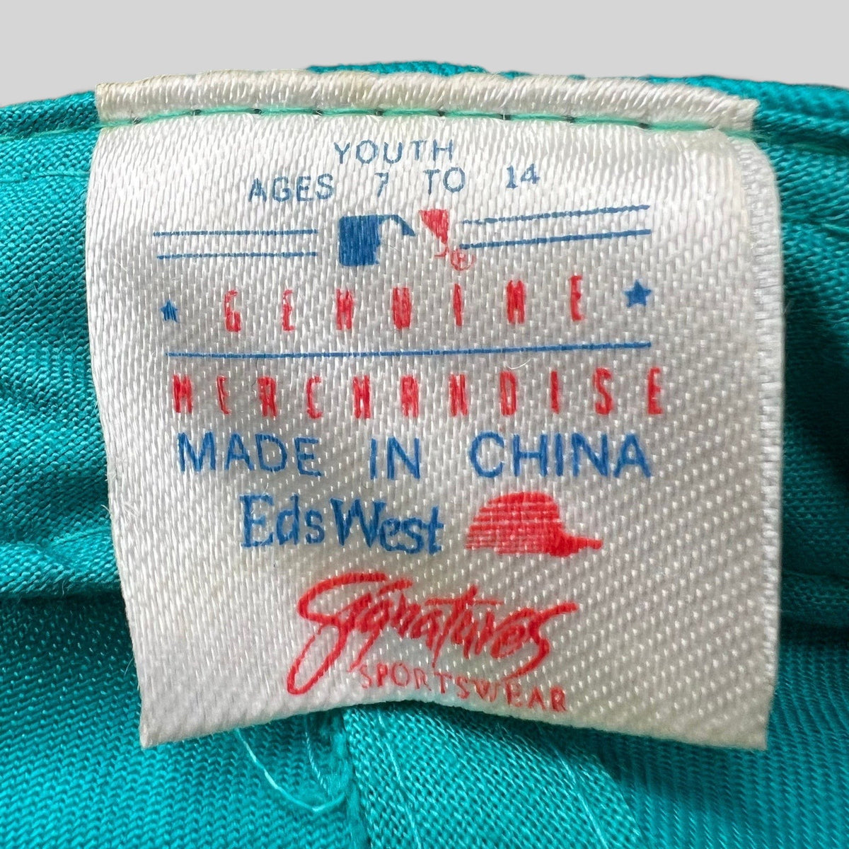 Raree Finds vintage Florida Marlins youth cap interior tag showing Genuine Merchandise and Sportswear branding