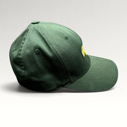 Raree Finds forest green Hanalei Canoe Club Flexfit hat with gold embroidered paddle logo, side profile view.