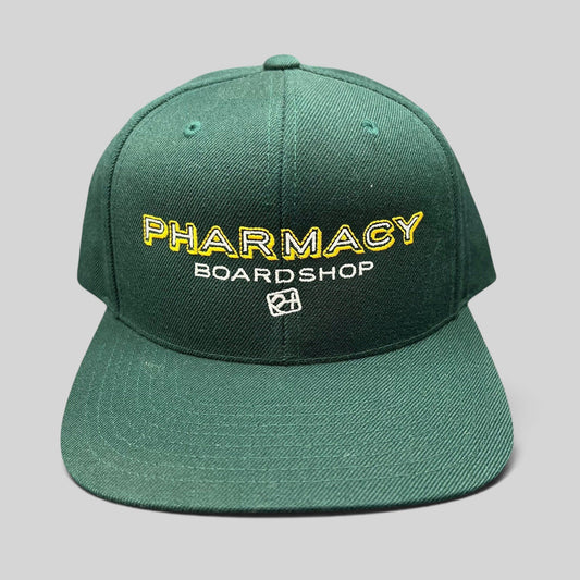 Raree Finds vintage forest green Pharmacy Boardshop snapback hat with yellow and white embroidered skate branding