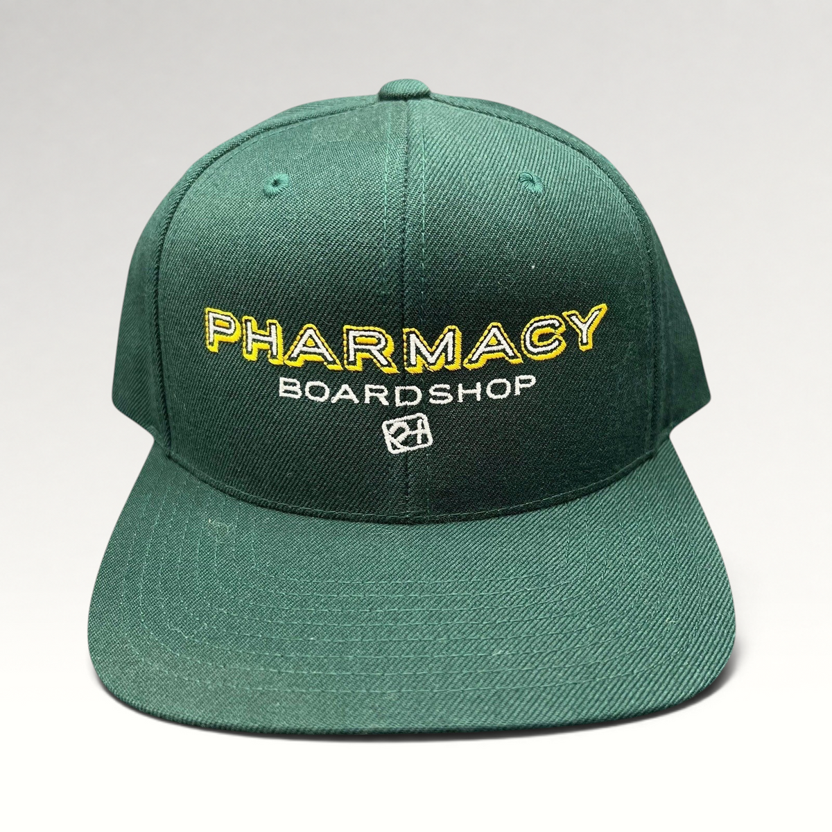 Raree Finds vintage forest green Pharmacy Boardshop snapback hat with yellow and white embroidered skate branding