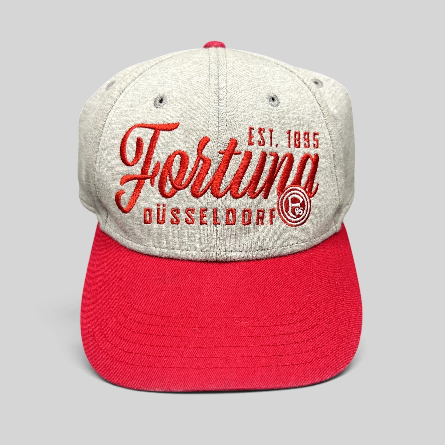 Raree Finds Fortuna Düsseldorf heather gray strapback hat with red brim and embroidered vintage soccer club graphics.
