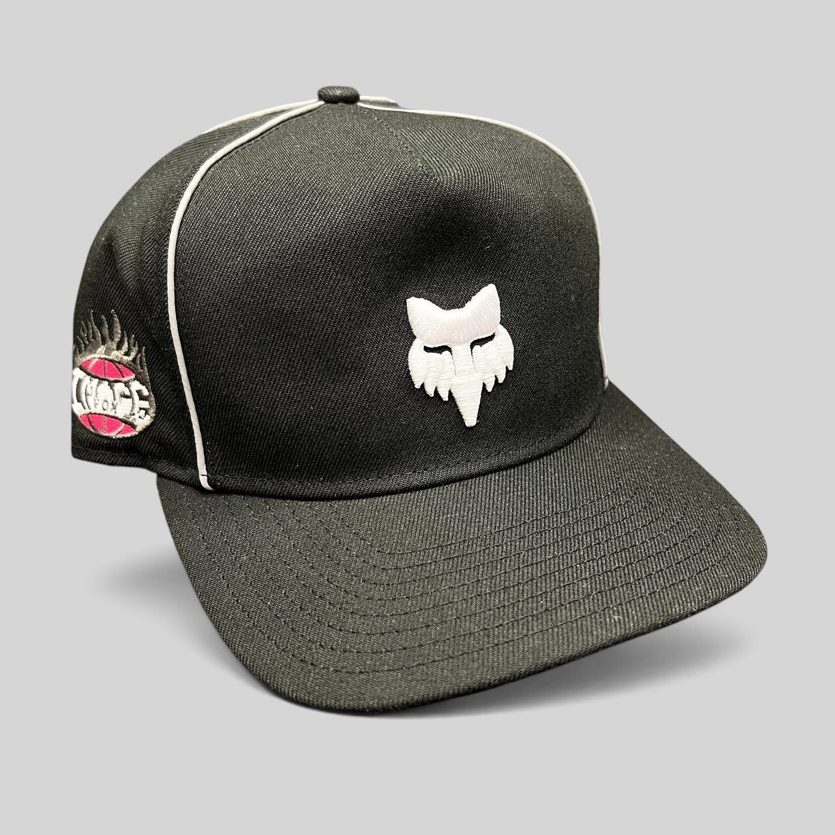 Raree Finds Fox Racing x New Era black snapback hat with white embroidered logo and pink side detail