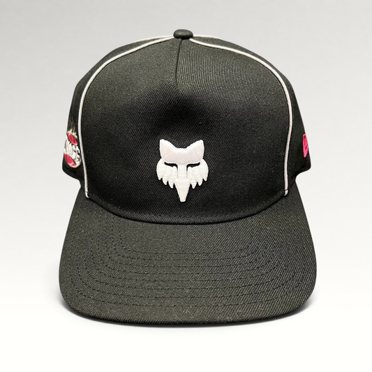 Raree Finds Fox Racing New Era Cosmo black snapback hat with white embroidered fox logo and pink side accents.