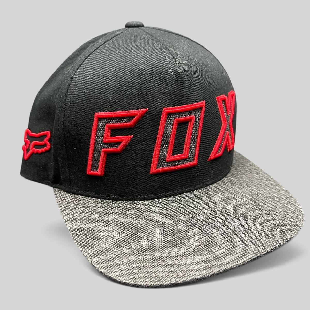 Raree Finds Fox Racing black snapback hat with red embroidered logo and heather gray flat bill