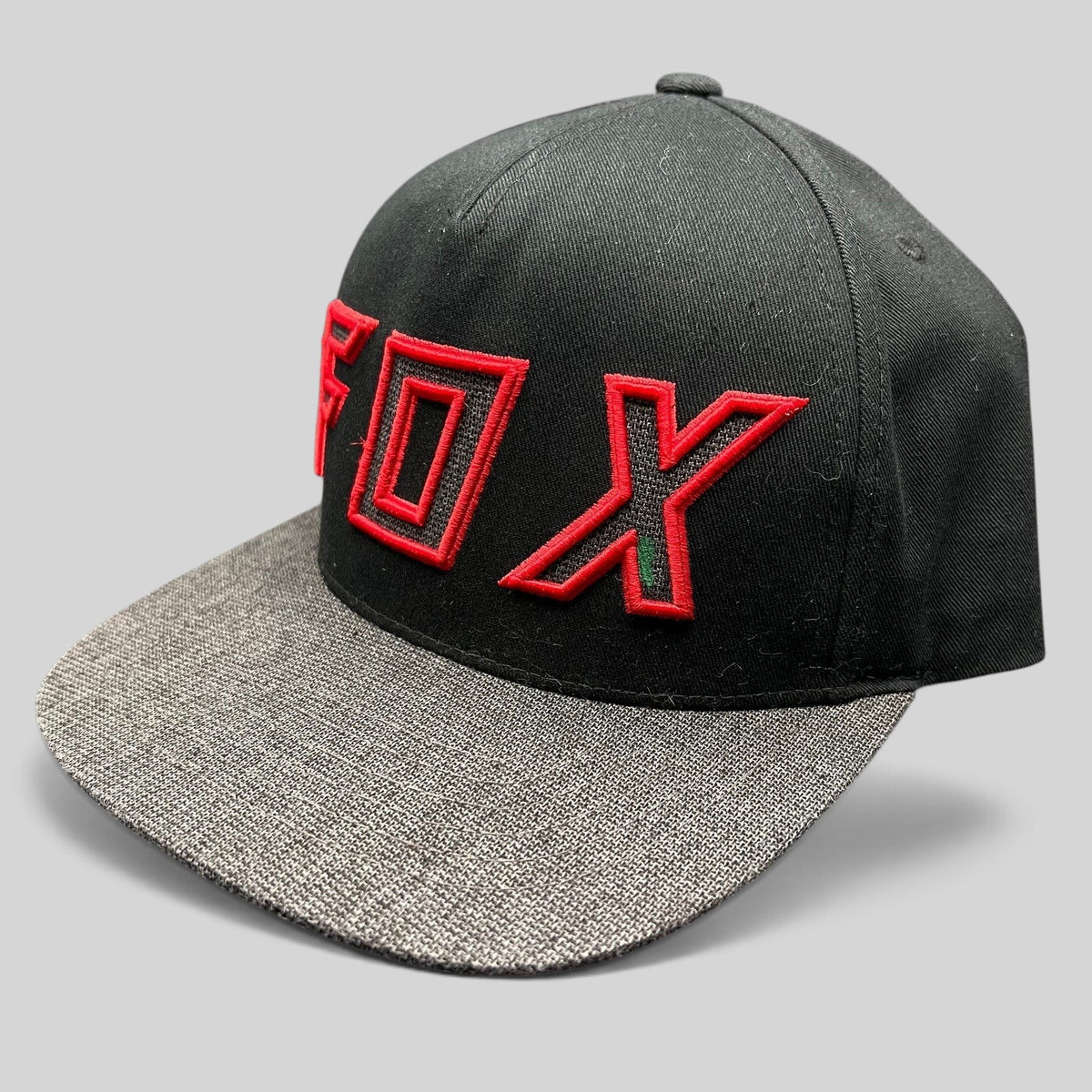 Raree Finds Fox Racing black snapback hat with red embroidered logo and heather gray flat bill