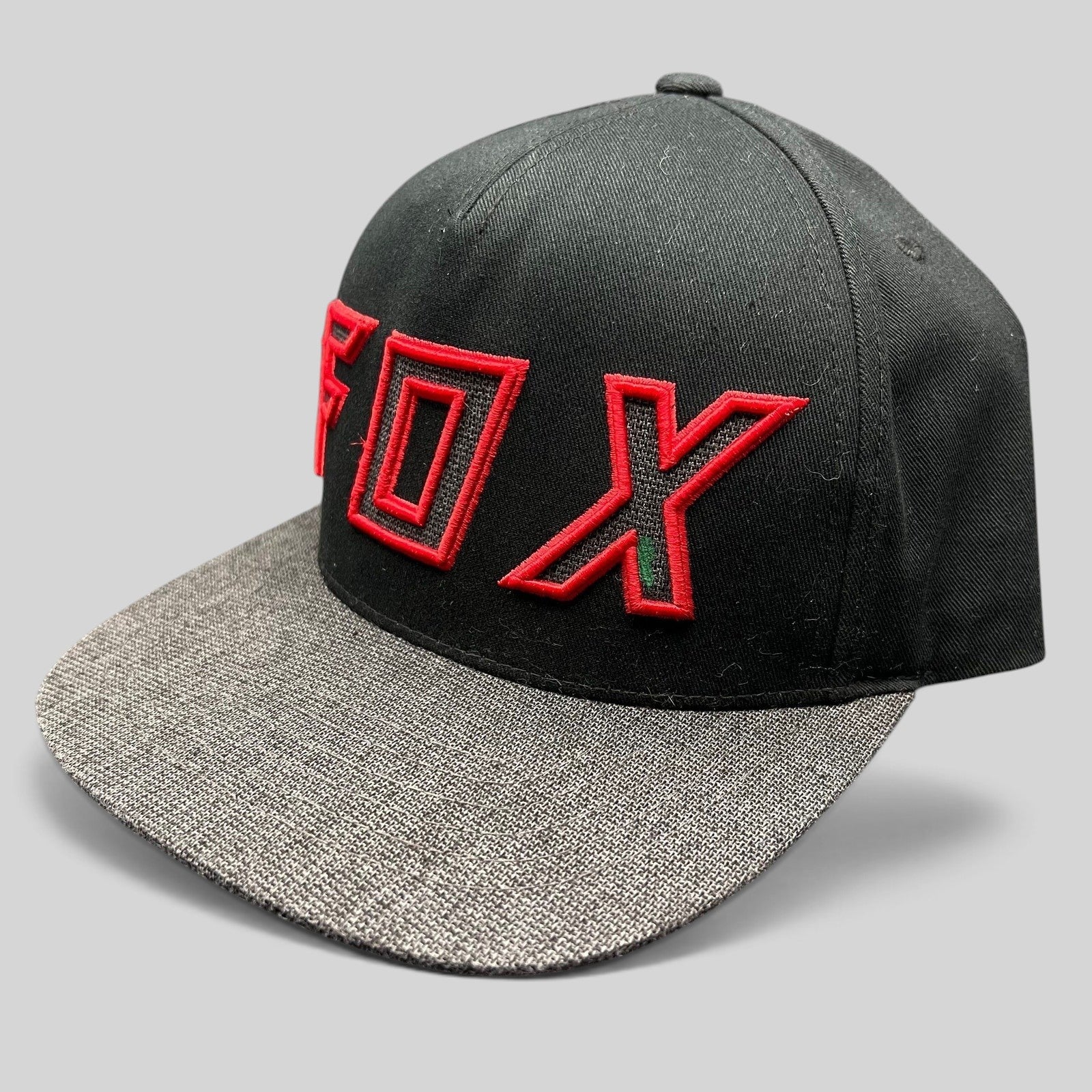 Raree Finds Fox Racing black snapback hat with red embroidered logo and heather gray flat bill