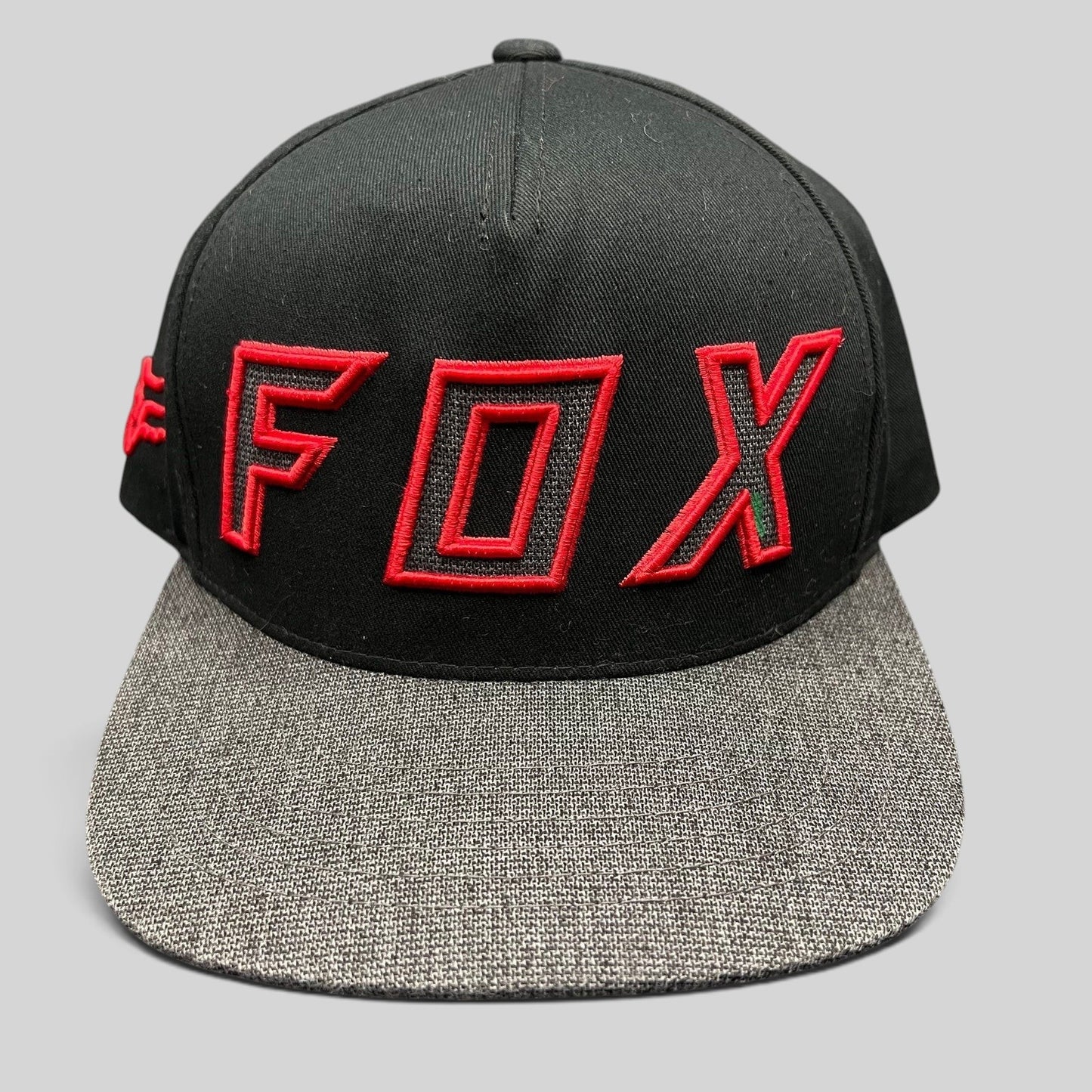 Raree Finds Fox Racing black snapback hat with red embroidered logo and heather gray flat bill