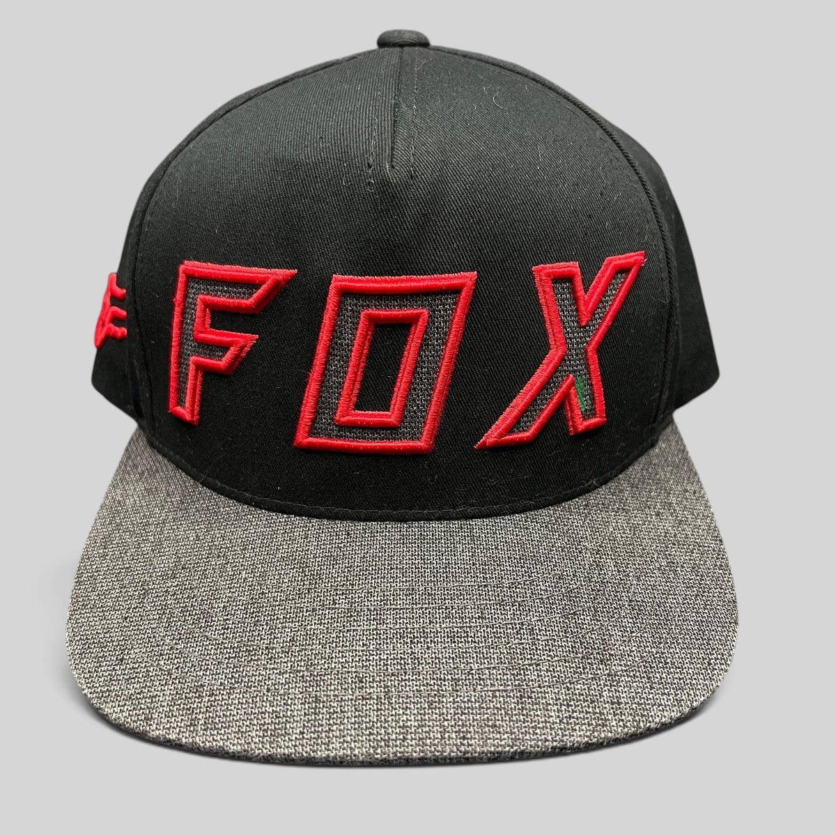 Raree Finds Fox Racing black snapback hat with red embroidered logo and heather gray flat bill