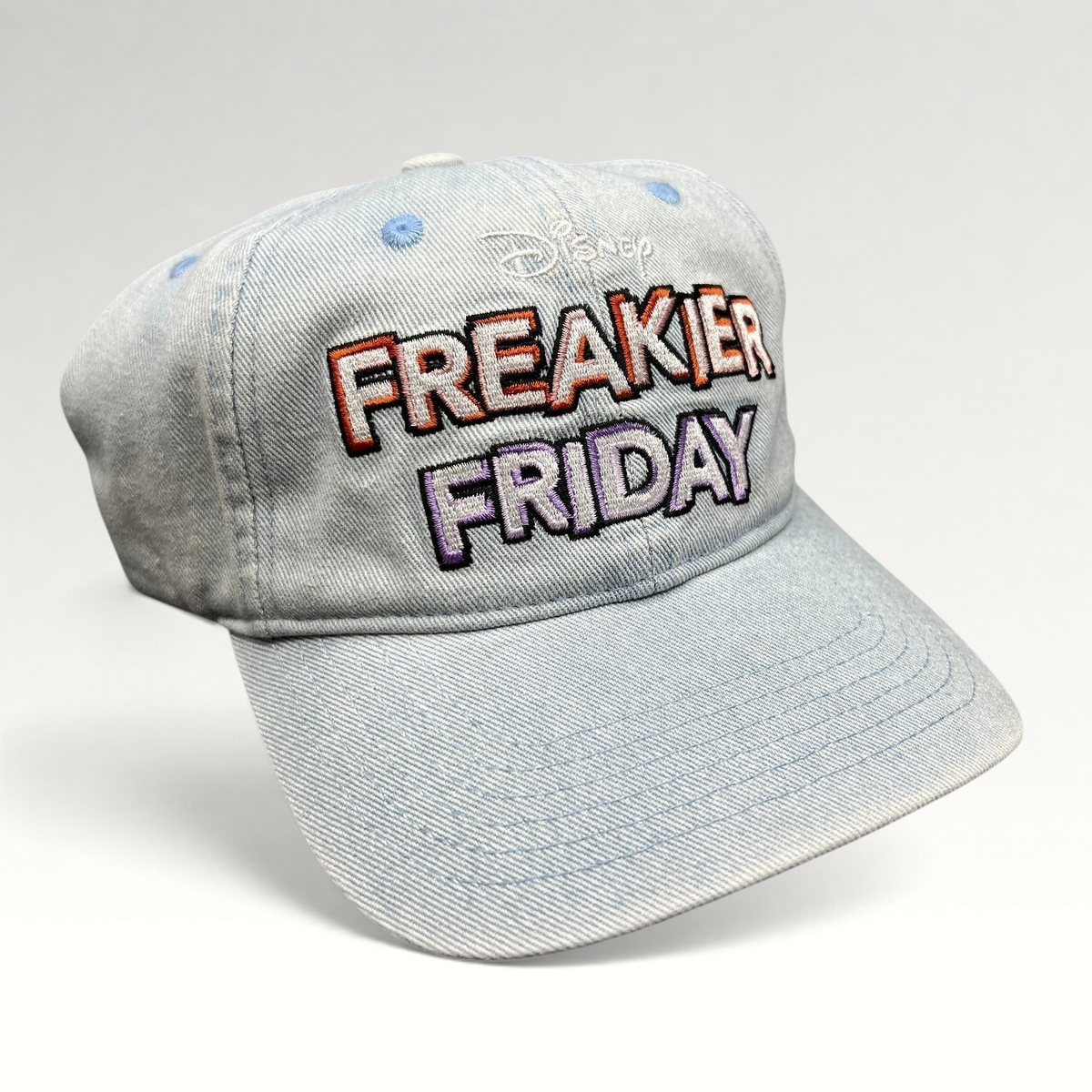 Raree Finds Disney Freakier Friday movie promo light blue washed cotton dad hat with multicolor embroidered lettering.