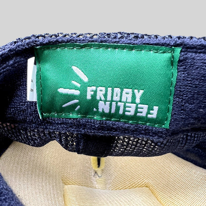 Raree Finds Friday Feelin’ green interior brand label inside a navy blue mesh trucker hat