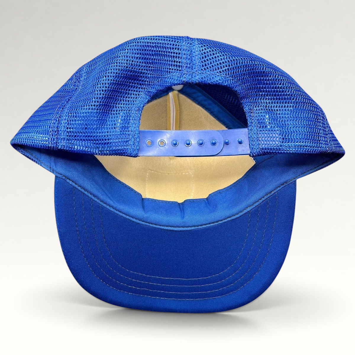 Raree Finds vintage Germany trucker hat showing the blue mesh back, adjustable snapback closure, and blue bill.