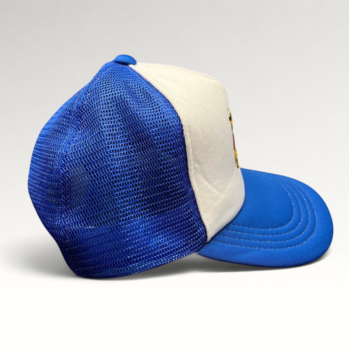 Raree Finds vintage Germany trucker hat with white foam front, royal blue mesh back, and embroidered eagle crest patch
