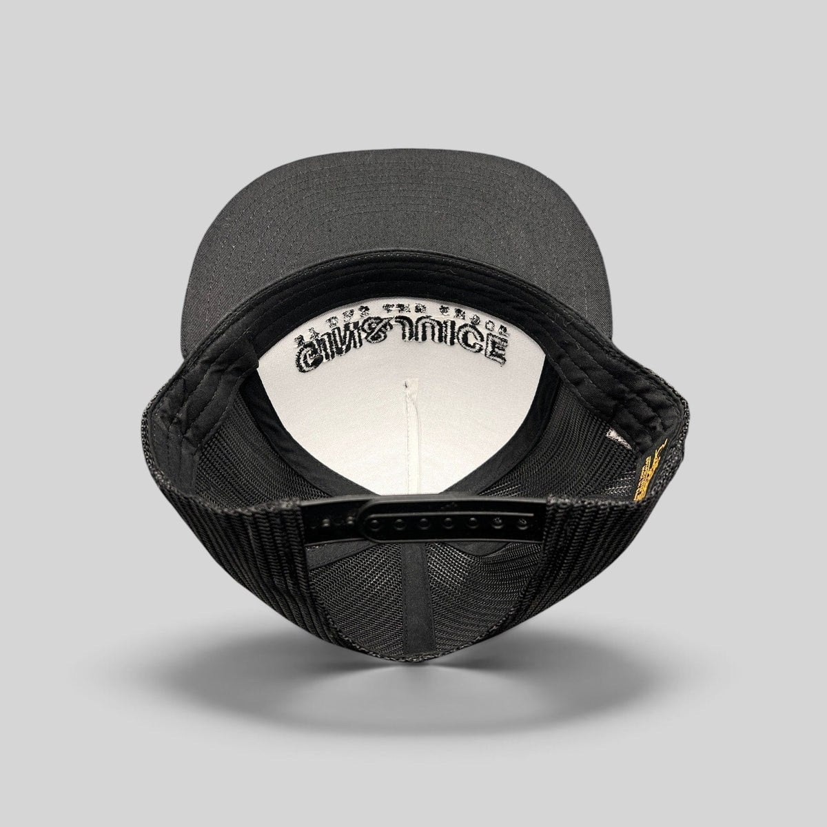 Raree Finds Gin & Juice black snapback hat showing the interior crown with branded embroidery and adjustable strap