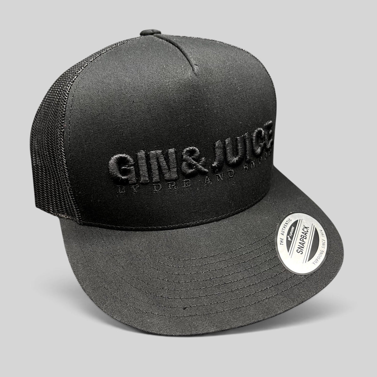 Raree Finds Gin & Juice black trucker snapback hat with tonal raised embroidery and breathable mesh back panels.