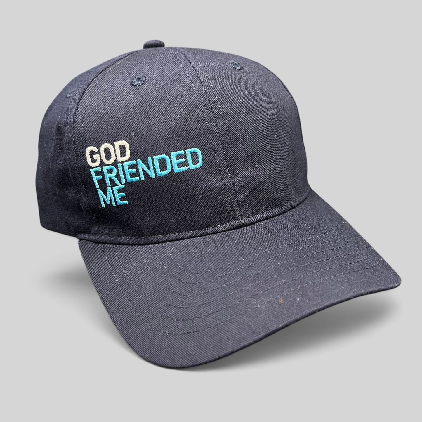 Raree Finds navy blue cotton strapback hat with God Friended Me embroidered in white and blue on the front