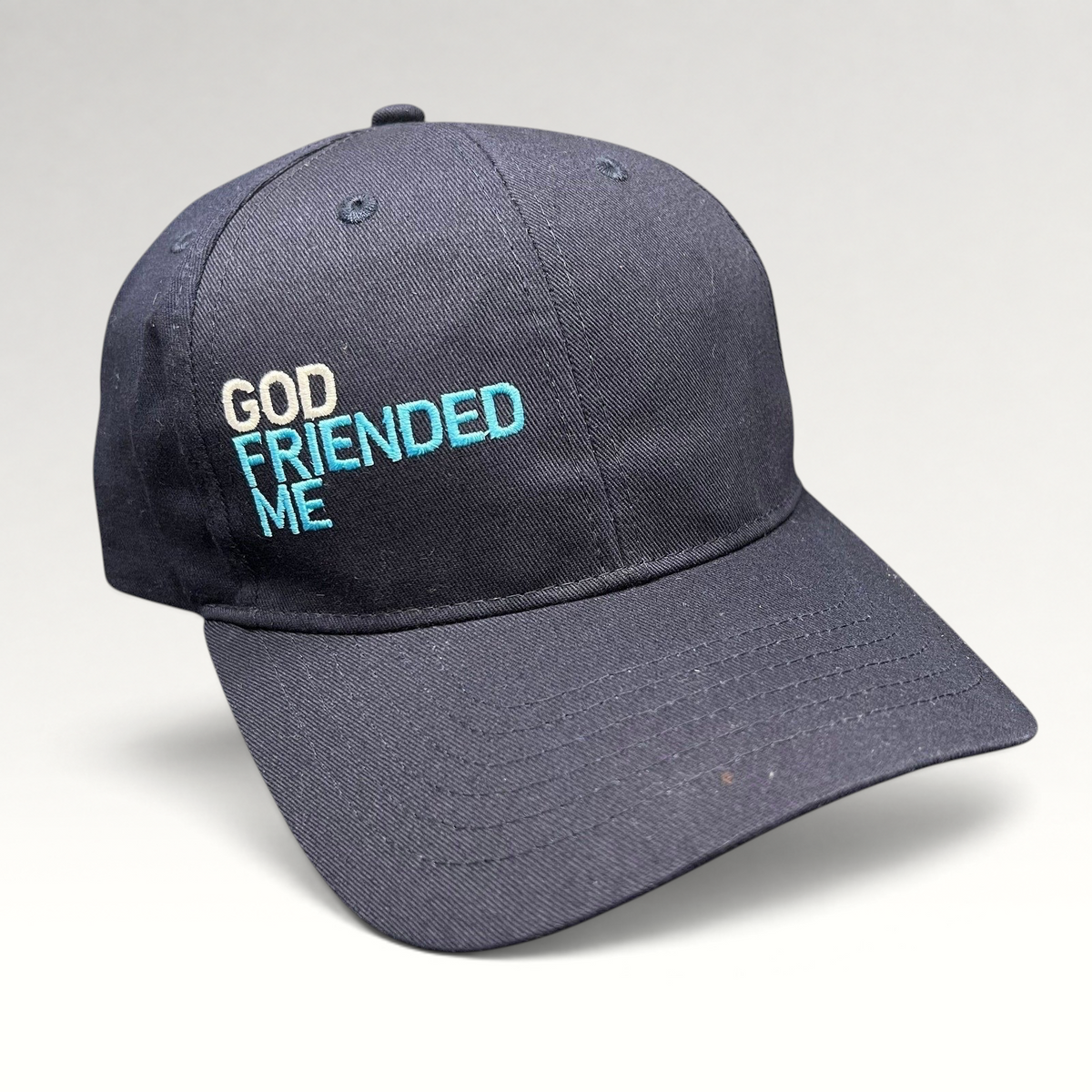 Raree Finds navy blue cotton strapback hat with God Friended Me embroidered in white and blue on the front