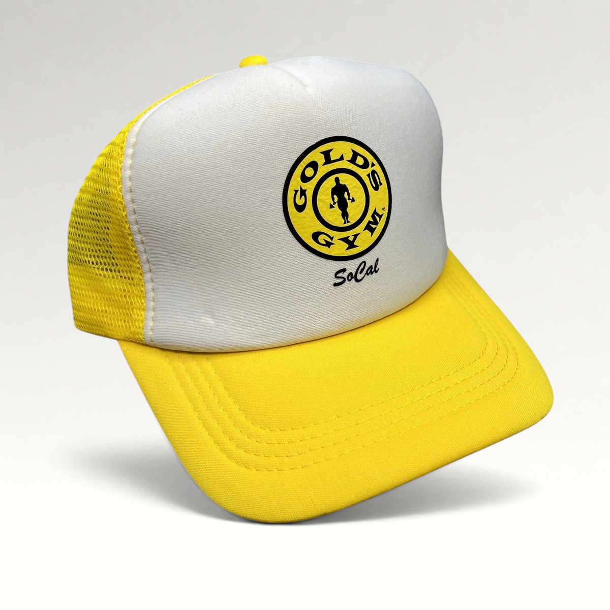 Raree Finds Gold’s Gym SoCal trucker hat in yellow and white with a breathable mesh back and adjustable snapback.