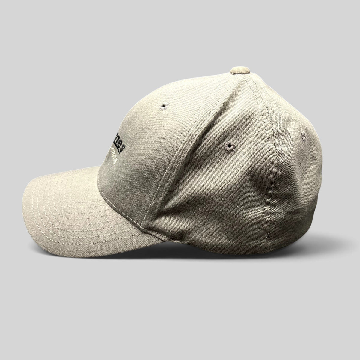 Raree Finds gray Yupoong Flexfit baseball cap with M Games 2004 event embroidery on a black background