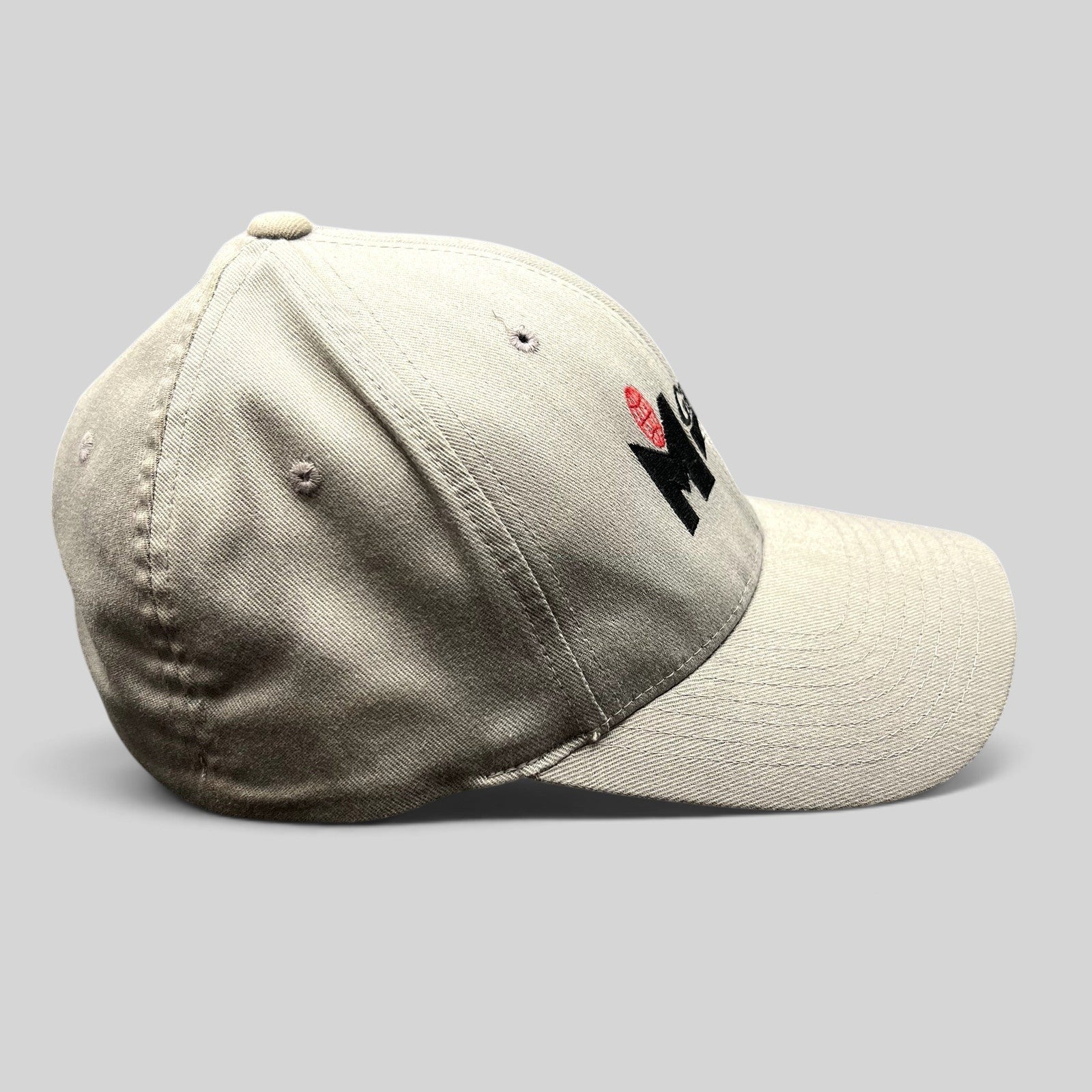 Raree Finds gray Yupoong Flexfit baseball cap with M Games logo embroidery, side profile view.