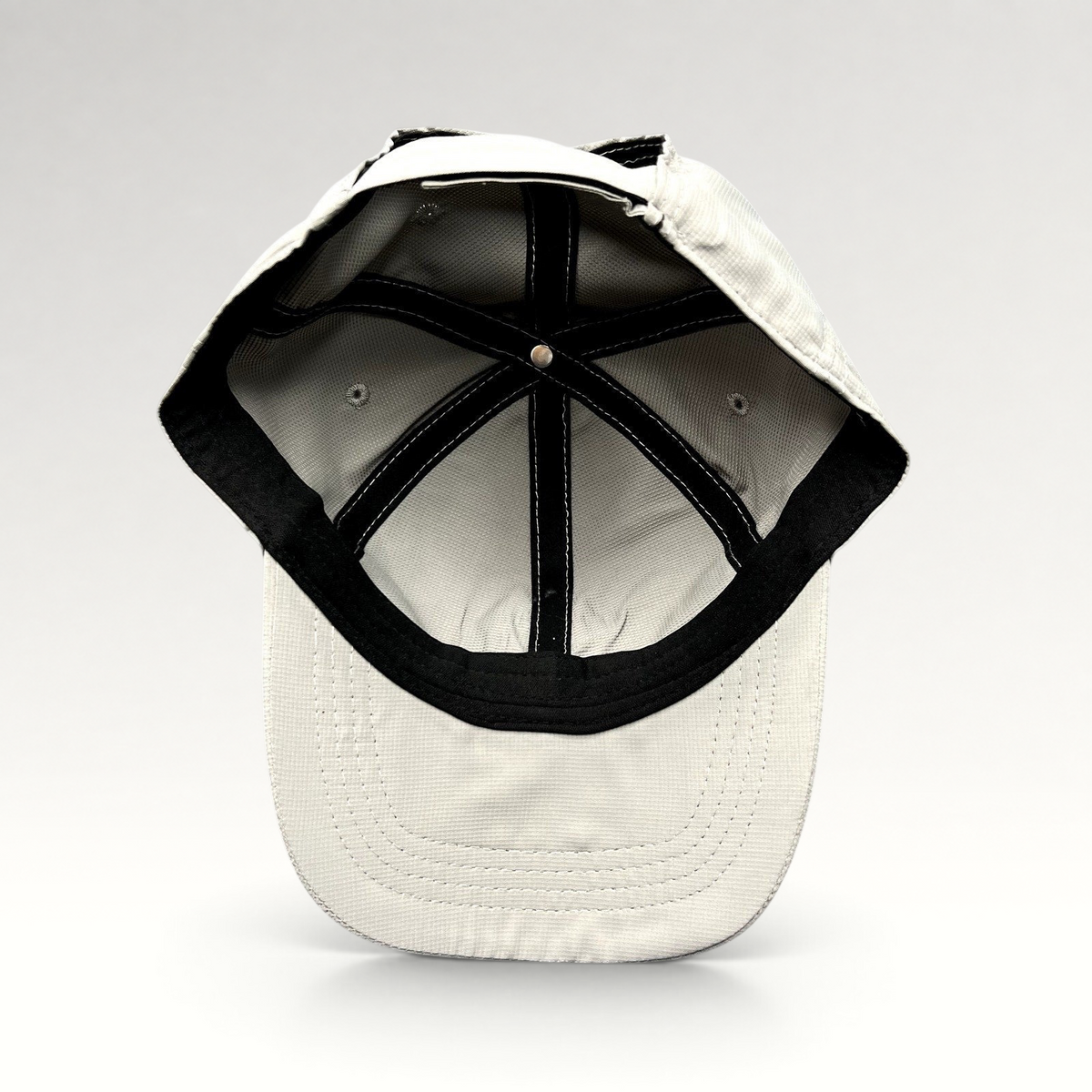 Raree Finds gray performance fabric golf cap interior view showing construction and adjustable strapback closure