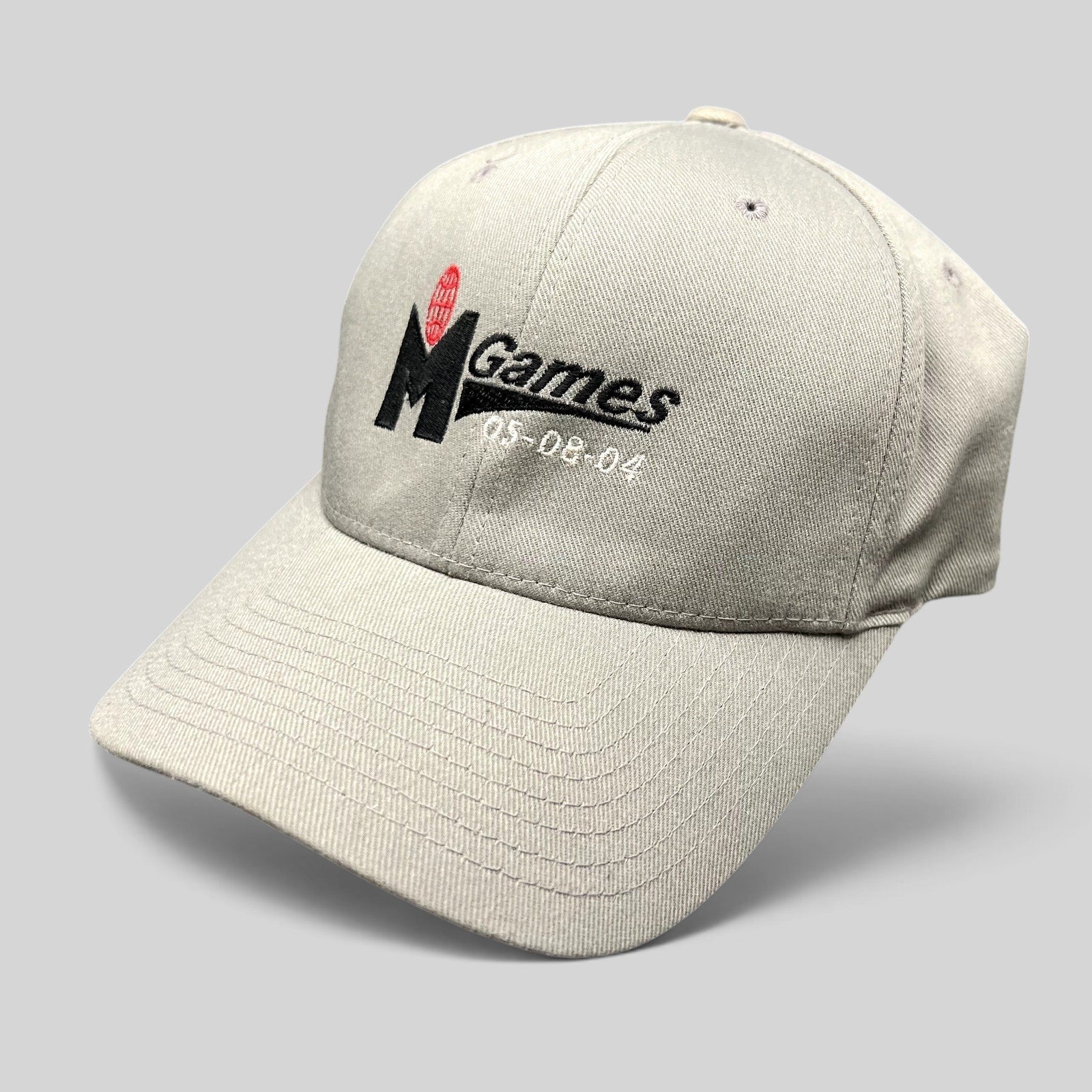 Raree Finds gray Yupoong Flexfit baseball cap with M Games 2004 event embroidery in black and red on a black background