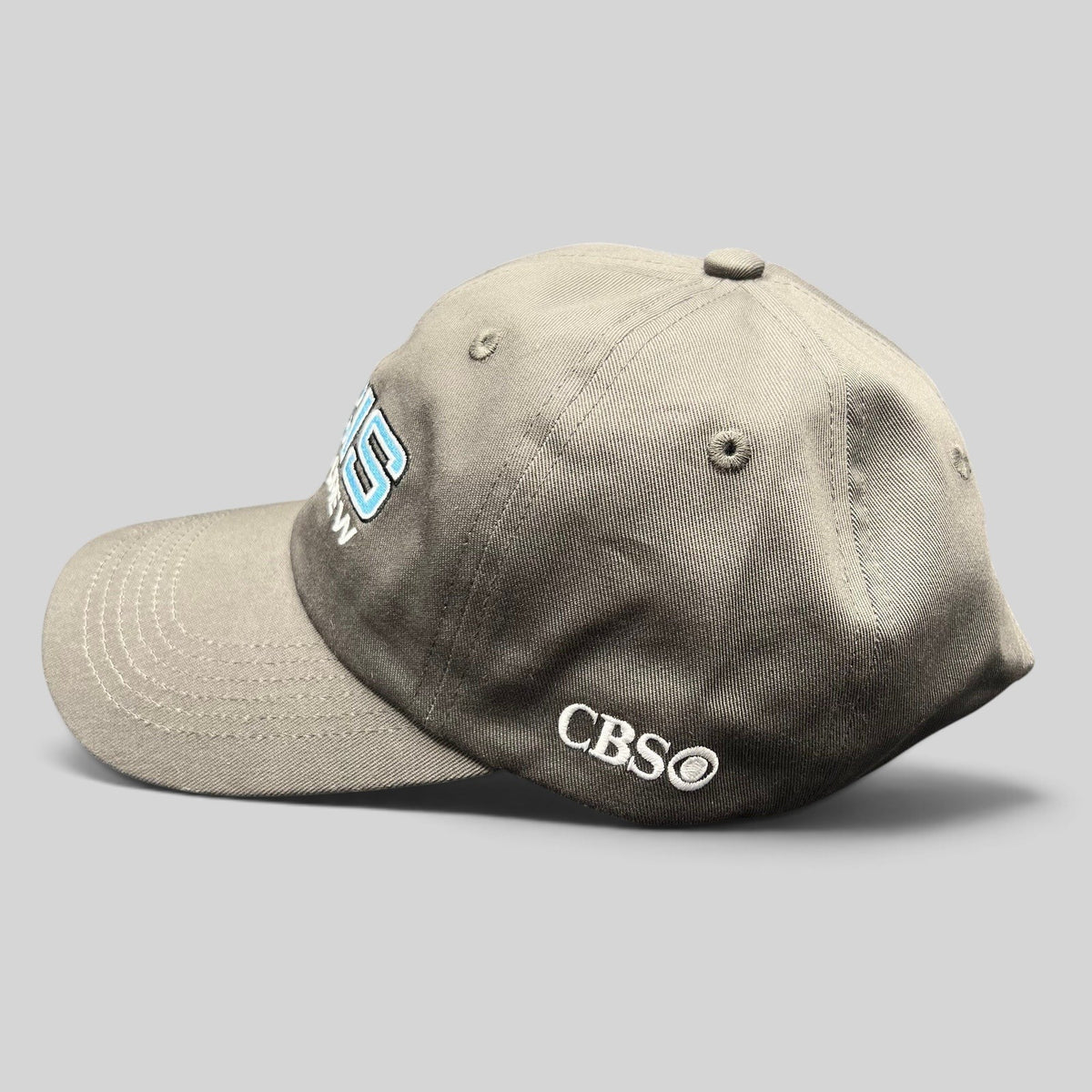 Raree Finds gray NCIS Cast & Crew strapback hat with blue and white embroidery and CBS logo on the side