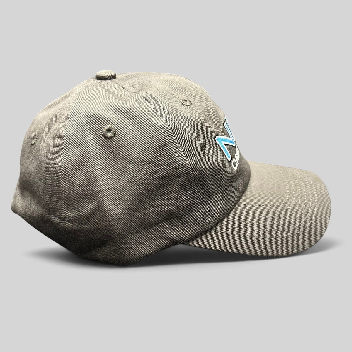 Raree Finds gray NCIS Cast & Crew strapback hat with blue and white embroidered logo and curved bill
