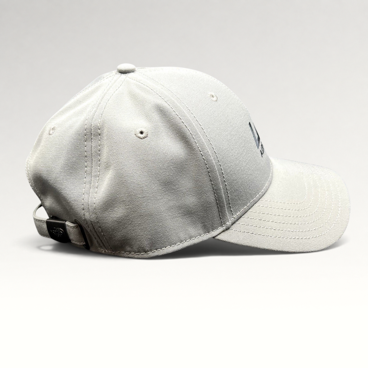 Raree Finds gray The North Face strapback hat with Lift Aircraft embroidery and black metal hardware side view