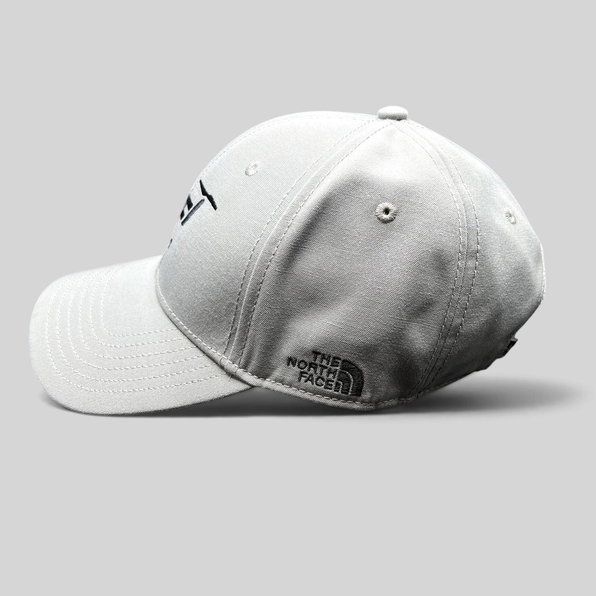Raree Finds gray The North Face strapback hat with black Lift Aircraft embroidery and side logo on a black background