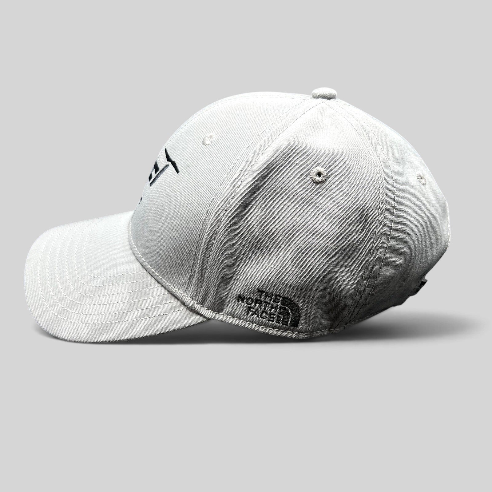 Raree Finds gray The North Face strapback hat with black Lift Aircraft embroidery and side logo on a black background