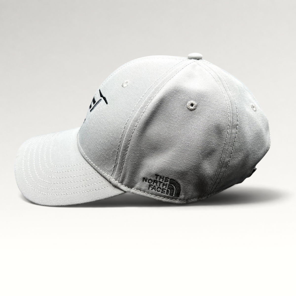 Raree Finds gray The North Face strapback hat with black Lift Aircraft embroidery and side logo on a black background