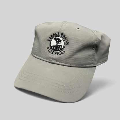 Raree Finds gray performance fabric golf cap with embroidered Pebble Beach Golf Links 1919 logo and strapback closure.