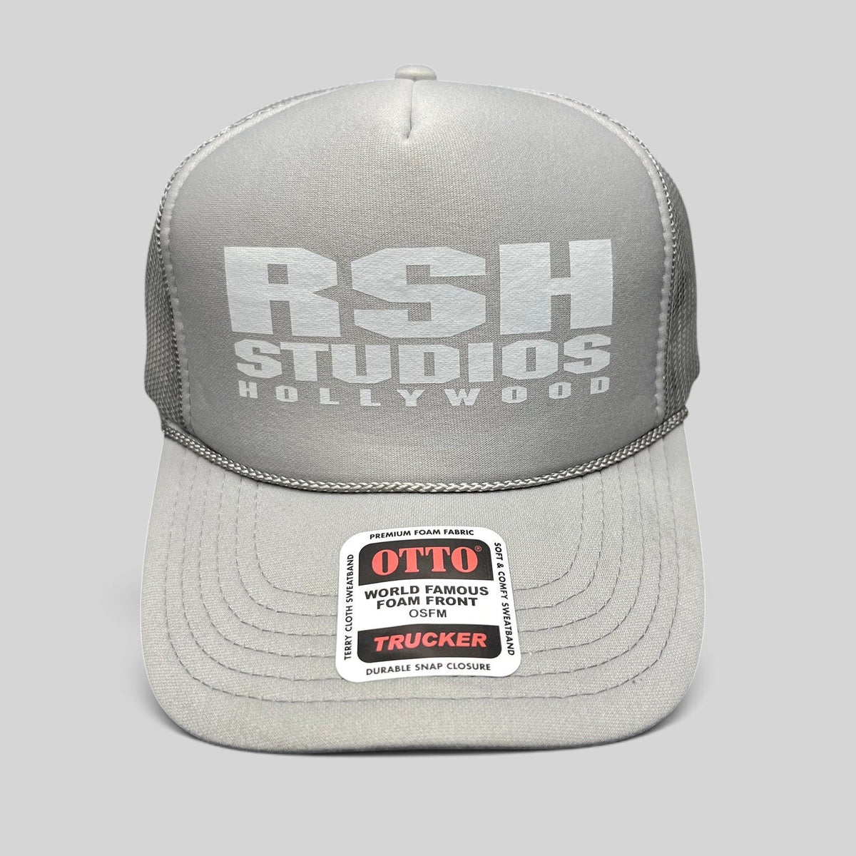 Raree Finds RSH Studios Hollywood gray trucker hat with white tonal print, mesh back, and braided brim rope detail.